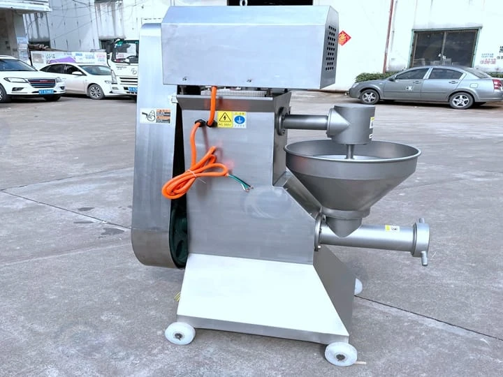 Side view of potato masher machine